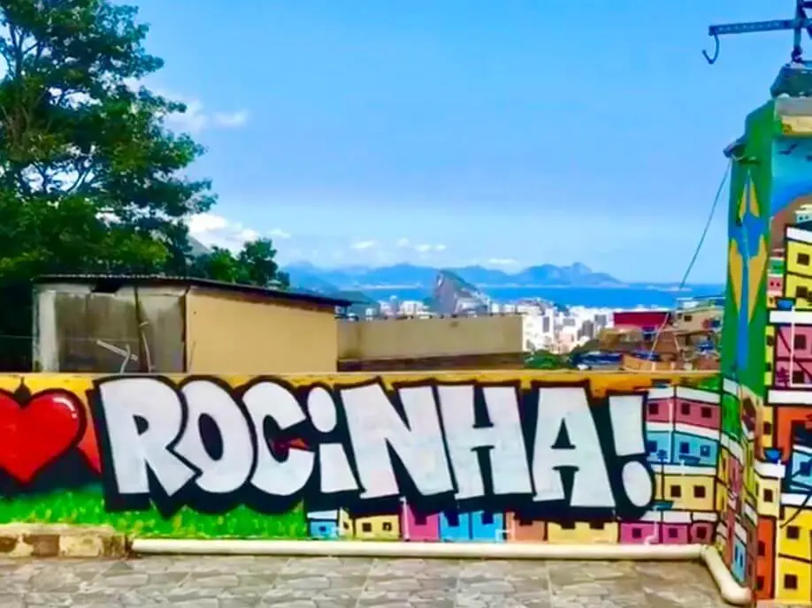 Colorful Rocinha sign with ocean view